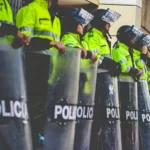 Riot police with shields lined up
