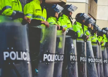 Riot police with shields lined up