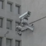 a cctv camera on the side of a building