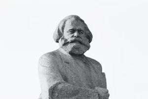 a statue of karl marx on a white background