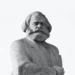 a statue of karl marx on a white background