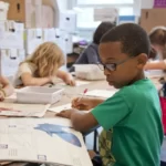 children sat around a table in primary school