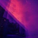 Artistic abstract image in various hues of purples, blue and black