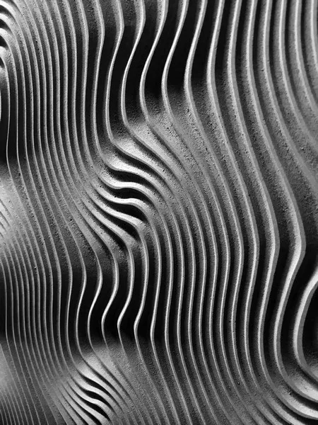 an abstract image of grey wavey patterns