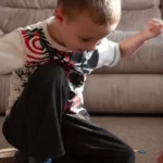 A young boy demonstrating ability by doing a jigsaw puzzle