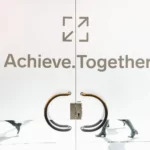 A door with achieve together written in gold