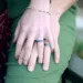 2 hands wearing wedding rings showing status