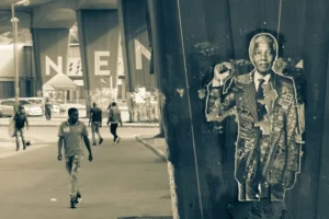 A graffitti image on a wall depicting Nelson Mandela the anti-apartheid campaigner
