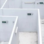 A maze like prison with white walls