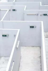 A maze like prison with white walls