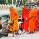 A line of Buddhist monks in buddhism