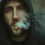 A working class man smoking