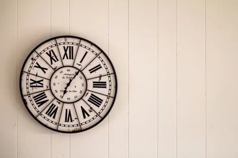 A wall clock in the roman numeral style