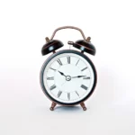A classic alarm clock reading 10:45