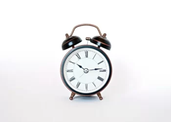 A classic alarm clock reading 10:45