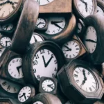 A pile of wooden clocks
