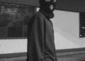 a man wearing a balaclava being a bad actor