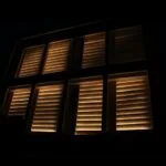 a dark shot of some window shutters