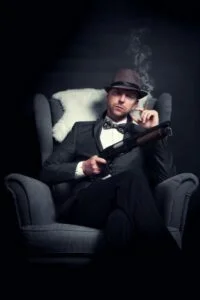 A corporate crime gangster in the back of car with a cigar