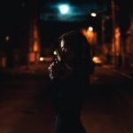 A female criminal in the shadows
