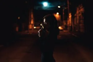 A female criminal in the shadows