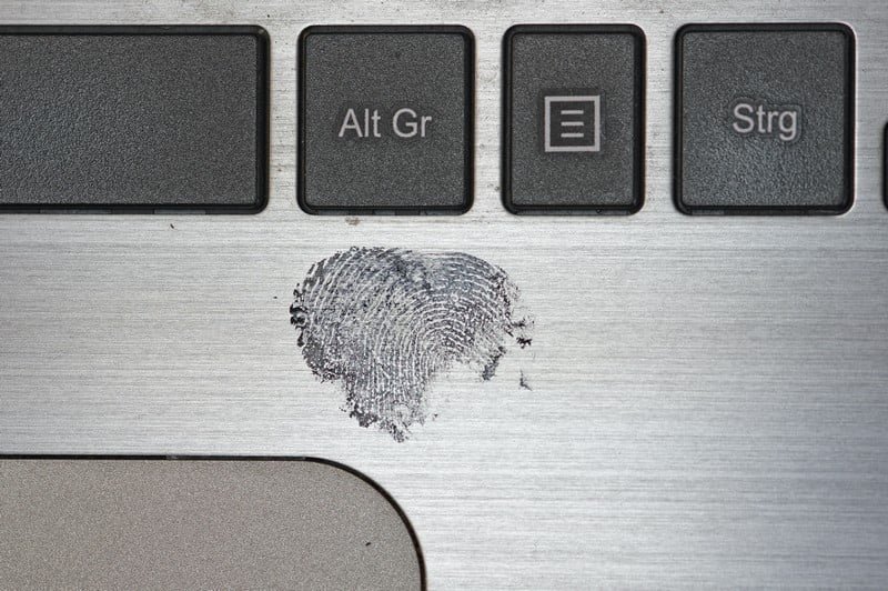 a fingerprint on a laptop - crime deviance
