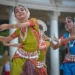 A group of indian women peforming a traditional indian dance