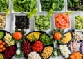 a wide and colourful variety of fruit and veg on plates