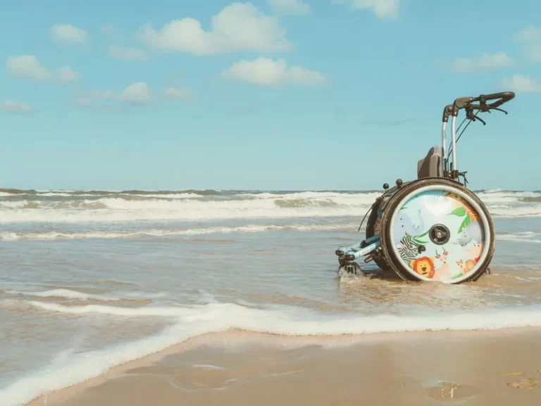 An empty wheelchair by the beach