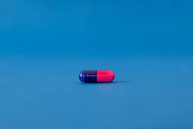 a blue and red pill against a blue background