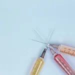 three hyperdermic needles crossed over each other