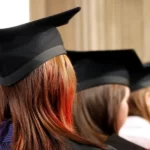 rear view of a womans head wearing a university mortar