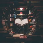a floating book in the middle of more education books