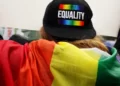 a person wearing a cap that says equality