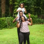 A family stood in a garden