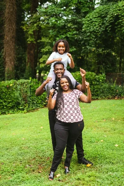 A family stood in a garden