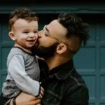 A man holding his son