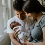 new parents bonding with their baby