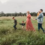 A family walking in a field - social bonds