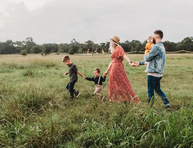 A family walking in a field - social bonds