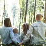 A family of four in the forest