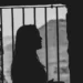 silhouette of female prisoner - crime and deviance