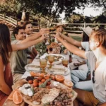 A group of people having drinks at a social gathering with conformity to social norms