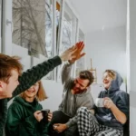 4 friends high fiving - social capital