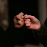two hands fist pumping - attitudes