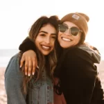 two women hugging and smiling and being good actors