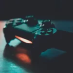 A playstation 4 controller in shaded light