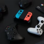 A playstation 4 controller next to a nintendo switch