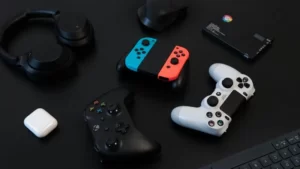 A playstation 4 controller next to a nintendo switch
