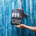 A sign saying 'all gender bathroom'